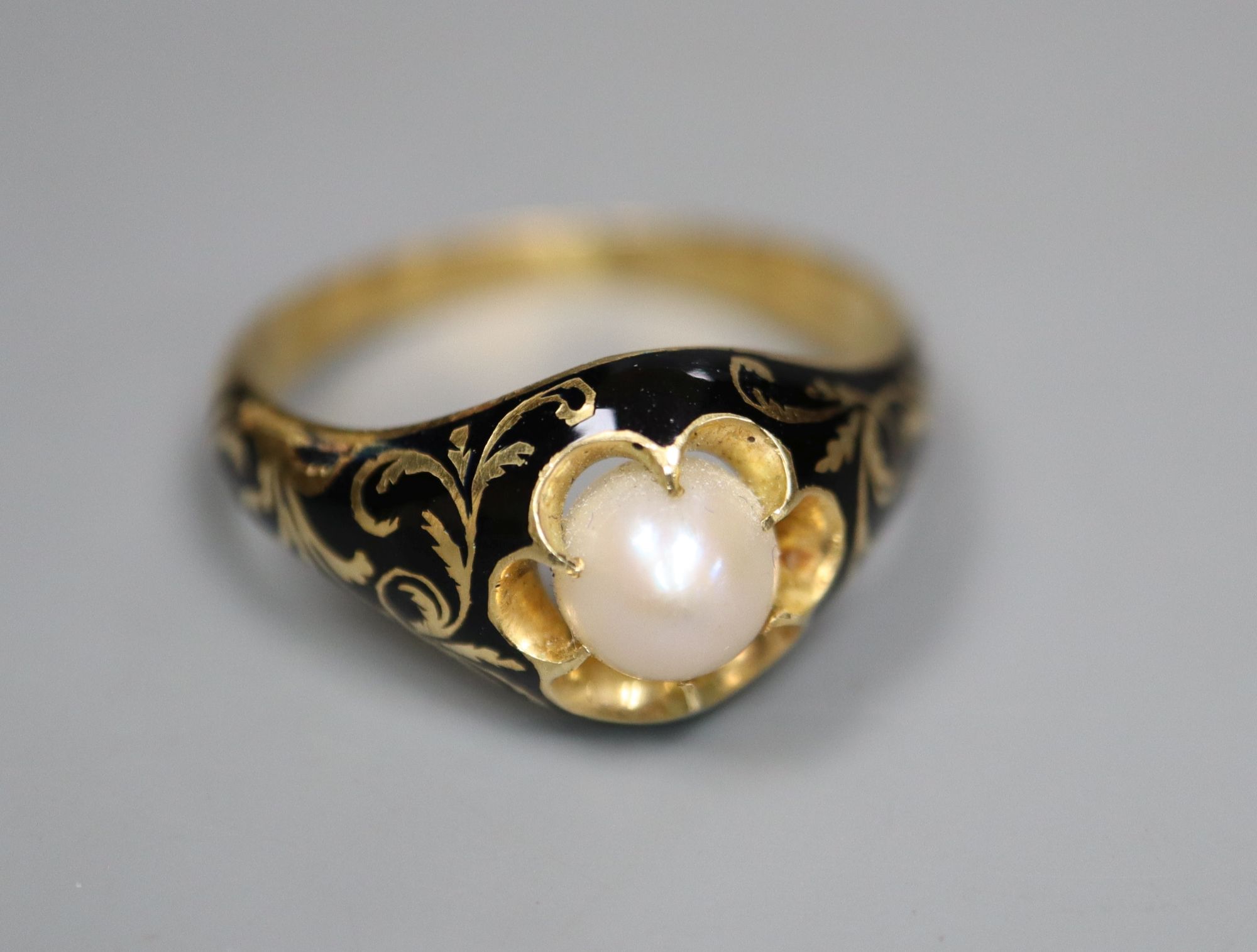 A Victorian 18ct gold, black enamel and pearl memorial ring, gross 3.7 grams, size Q.